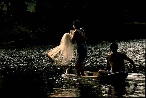 (obr011-Don Klein) - Locals tossing a fishing net into Amazon River, Brazil